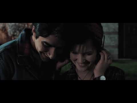 Trailer frame: friends sprinting through Luton streets during a music blast