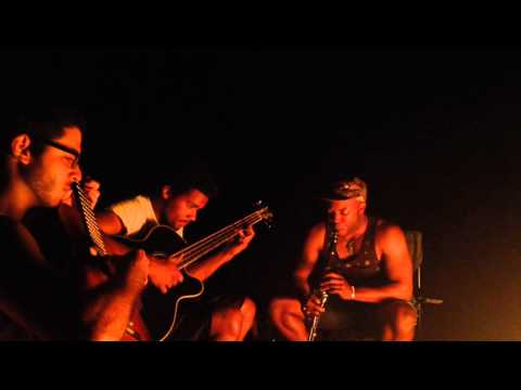 live campfire jam with clarinet, bass, and guitar