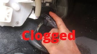 CUSTOMER STATES: Floorboard is wet and fluid leaking from under car. Nissan Rogue water leak