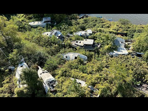 Exploring abandoned boat graveyard buried away in the woods