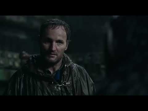 Trailer still: the ruined cityscape where the score’s travel and battle cues collide