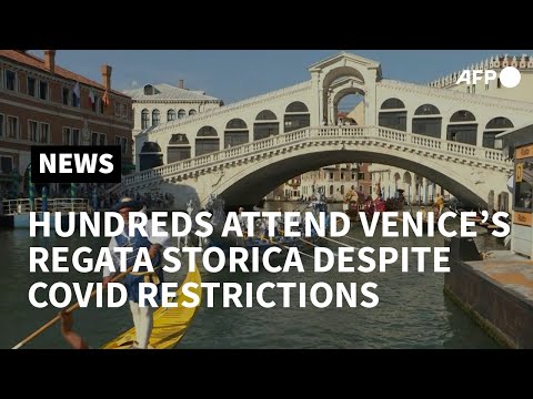 Hundreds attend Venice's Regata Storica despite Covid restrictions | AFP