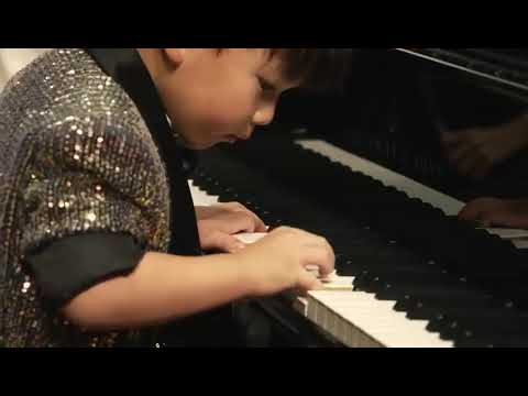3-year-old Barron Cheng performing piano with the orchestra