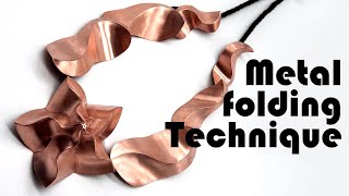 Jewelry making with metal folding technique.