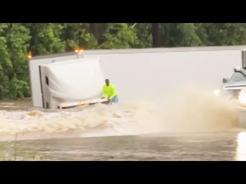 Dramatic video shows driver scrambling out of sinking truck in Texas flood