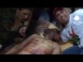 Jubilant Libyan fighters parade Gaddafi's body