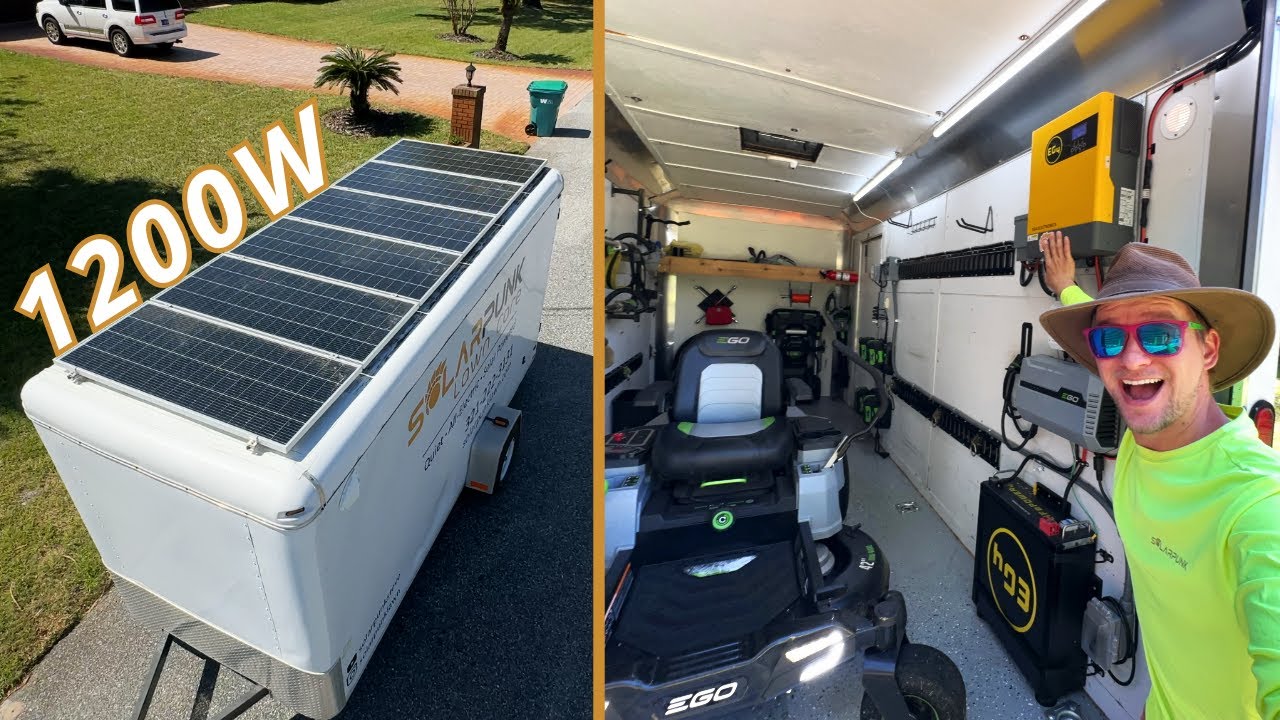 Solar panels mounted on the roof of a lawn care trailer with wiring and inverter visible inside