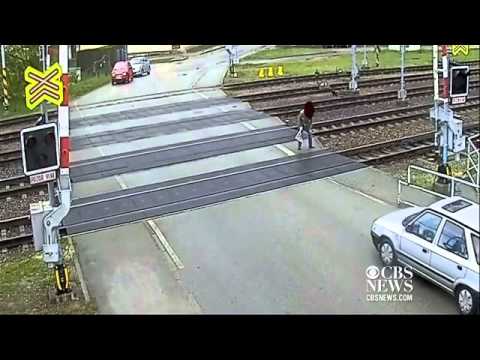 Watch: Man walks away after being hit by train