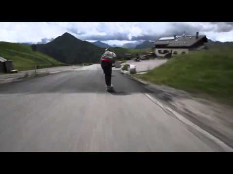 These skateboarders are blowing by the cyclists in the ALPS.