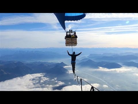 Video Thumbnail: Slackliners set world record, balancing at 2,500 metres high between hot air balloons