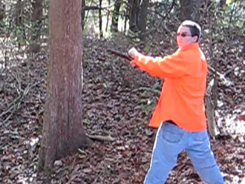 Jeremiah shooting a very old black powerd pistol 1 of 2