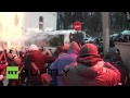 Ukraine: Kiev protesters beat police officers with ...