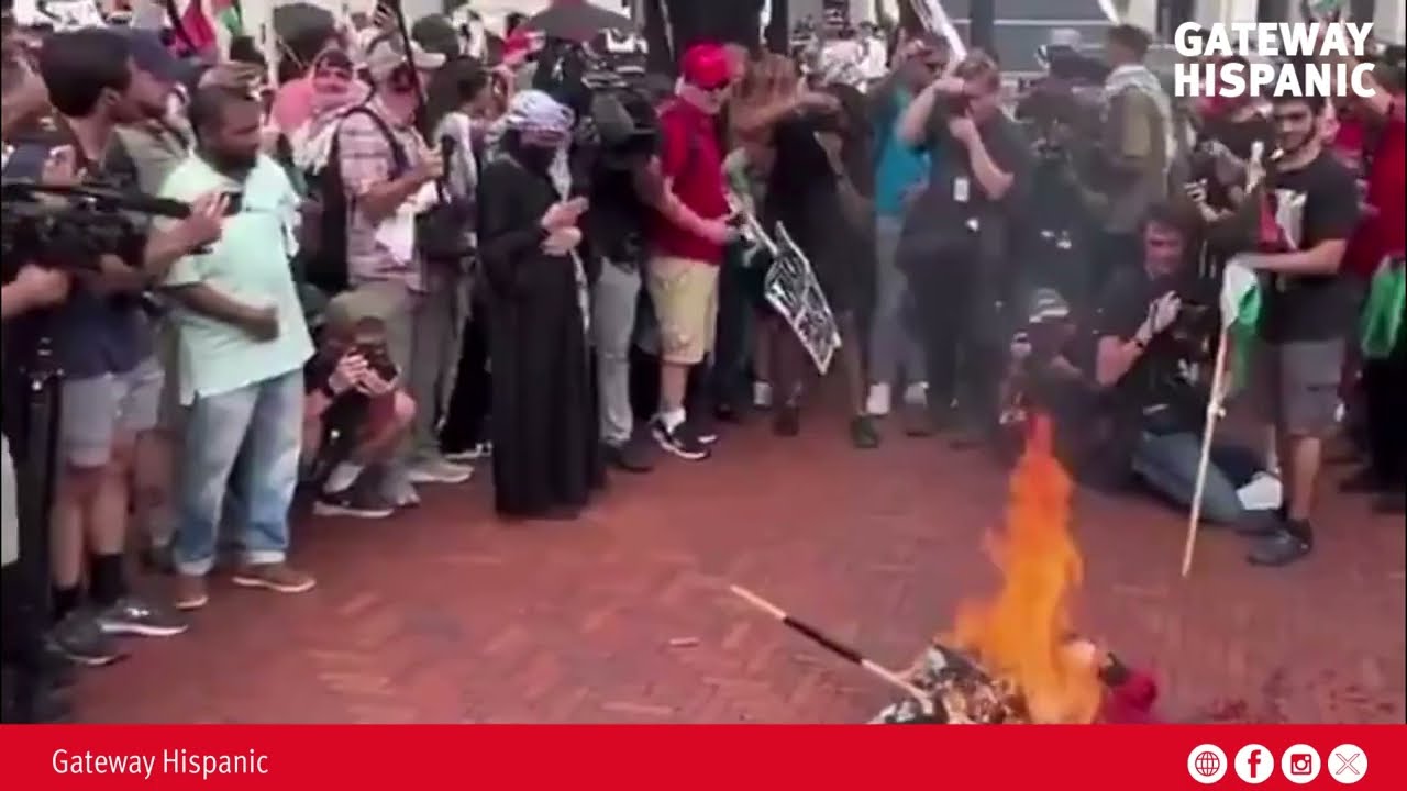 Young Islamists and communists unite to burn U.S. flags and chant “Allahu Akbar.”