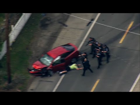 Seattle police say a man opened fire on motorists in what authorities call a "random" attack that left two dead and two injured Wednesday afternoon. One man was fatally shot and another killed in a car crash. The suspect was taken into custody. (March 28)