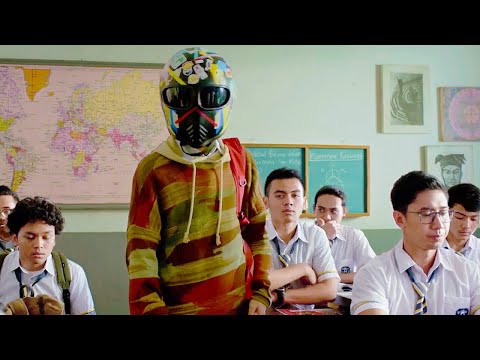 This boy is so handsome he has to wear a helmet.