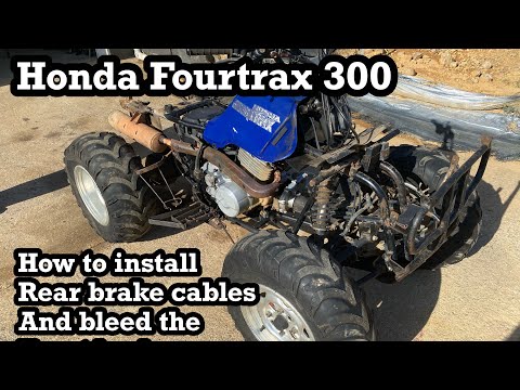 Honda fourtrax 300. Rear brake cable install and bleeding the front brakes. Part #2 of 5