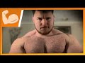 250lb bodybuilder flexing pecs and biceps after a heavy workout
