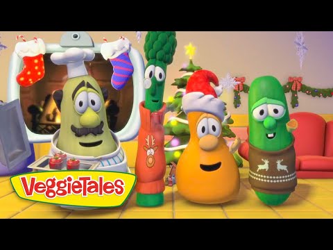 Three VeggieTales characters in holiday outfits celebrate in a festive living room with a Christmas tree and stockings.