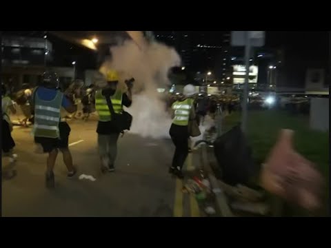 Police carrying riot shields and firing tear gas moved in shortly after midnight to clear protesters, who hours earlier, swarmed into the legislature's main building. (July 1)