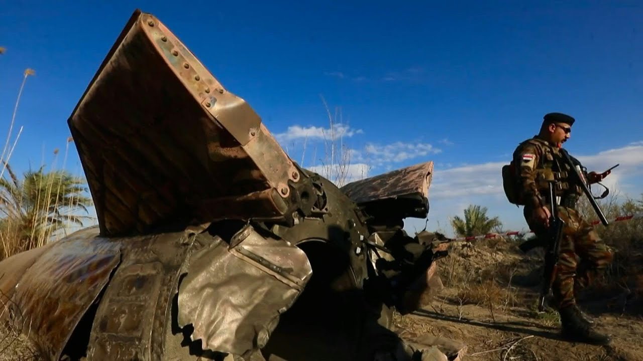Video | Iraqi officers inspect missile debris that landed in central Iraq | AFP