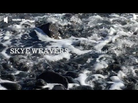 Waves washing ashore on pebble beach