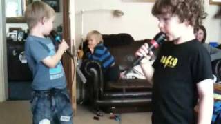 Charley, Nathan and Eliot playing singstar