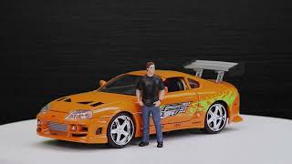 Fast & Furious - Toyota Supra 1:24 con figura de Brian (Jada 253205001) Trailer