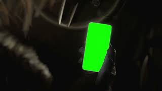Leon checks his phone — Resident Evil Requiem green screen