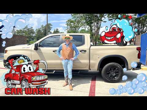 Person in a tan vest, blue shirt, jeans, and cowboy boots stands beside a beige pickup truck at a car wash, with cartoon bubbles and a red cartoon car in the foreground.