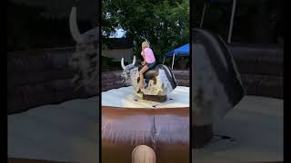 Bella riding the mechanical bull. Toby Keith! Big Bull Rider! Only 7 years old!