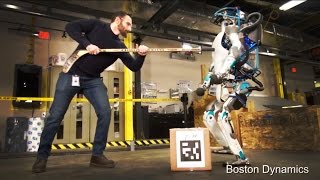 Atlas The Next Generation Robot - harassed with hockey stick!