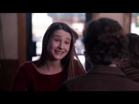 Freaks and Geeks official trailer still with Lindsay Weir walking the McKinley High hallway; a nod to the show’s era-true rock soundtrack