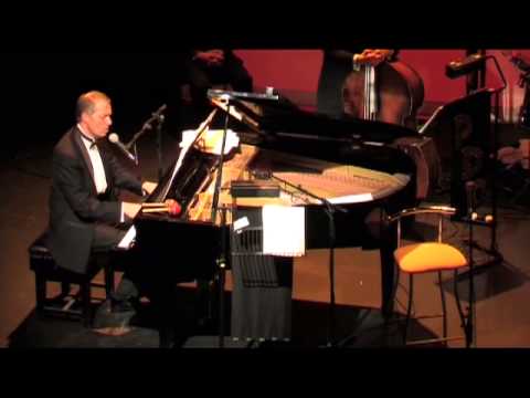 You'll Never Know, sung by Michael Law at the piano