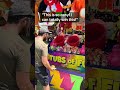 POV Carnival Game Where You Throw The Ball In The Bucket But It Only Counts If It Stays In