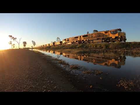 Aurizon 2339D & 2313D coal train at Coomi QLD on Sunset 2020