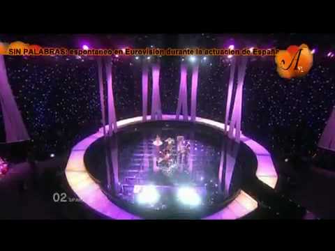 man in a woolly hat jumps on stage at eurovision 2010 in norway during spains live performance
