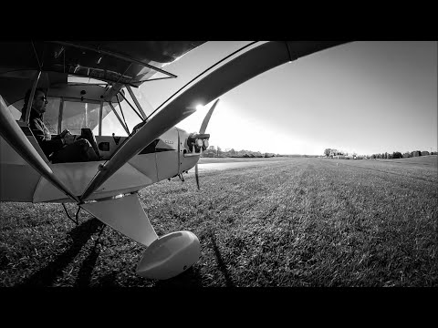 J3 Cub landing on grass