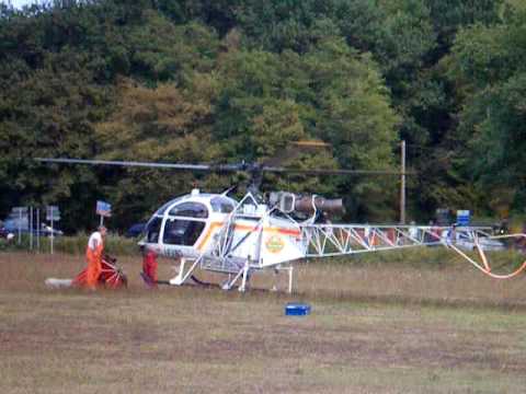 SA 315B Lama take-off + helicopter in action during a blaze