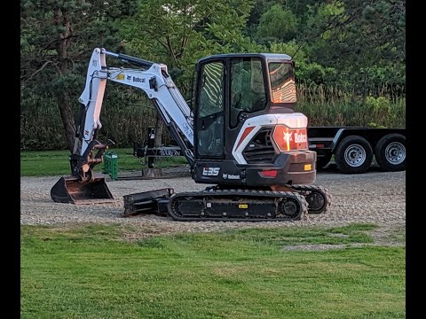 Mini Excavator tearing down a house