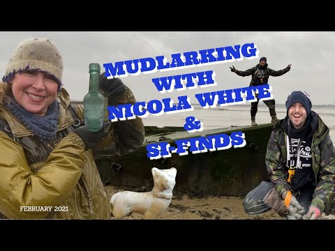 Mudlarking for treasure on an Isolated Wilderness of Mud