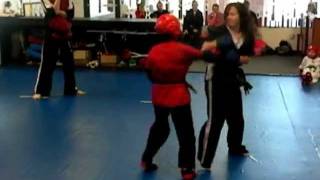 Tiger Paw Martial Arts : 12/03/2011 : Ms. Veronica Fighting TJ at his Dambo Black Stripe test