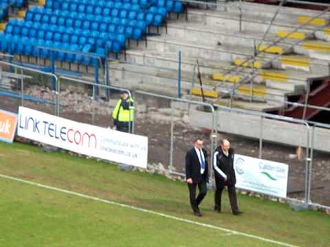 A member of the Colwyn Bay management is sent off after some over-zealous protesting.
