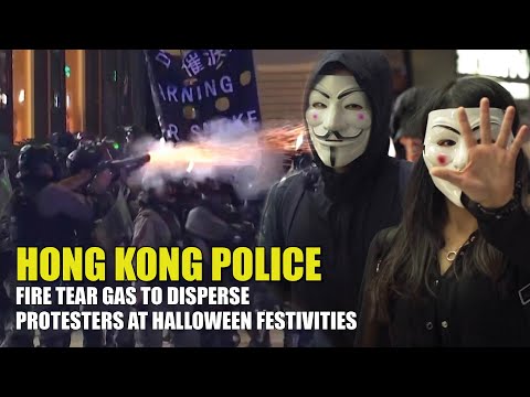 Hong Kong police fire tear gas to disperse protesters at Halloween festivities