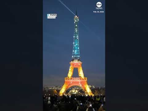 Eiffel tower lit up in colors of Ukrainian flag for third anniversary of Russian invasion
