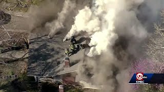 Kansas City fire crews battle house fire in the 5800 block of Holmes
