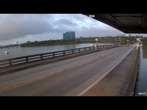 Watch This Maniac Bust Through A Traffic Gate And Jump A Rising Drawbridge