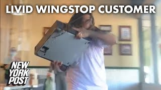 Video shows livid man toss register through Wingstop window | New York Post