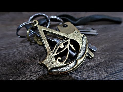 Casting a brass Assassin's Creed Origins Logo Keychain