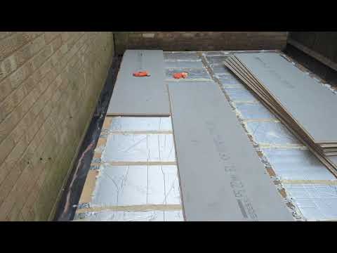 Garden Office Build: day 21, egger protect floor boards hoicked over the wall!