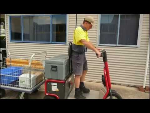 Skatework Tug Towing a Cage Basket Trolley 